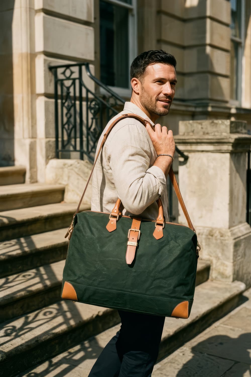A man walking down stone steps with the holdall over his shoulder
