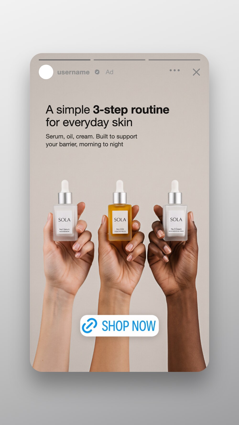 Three hands holding three skincare dropper bottles